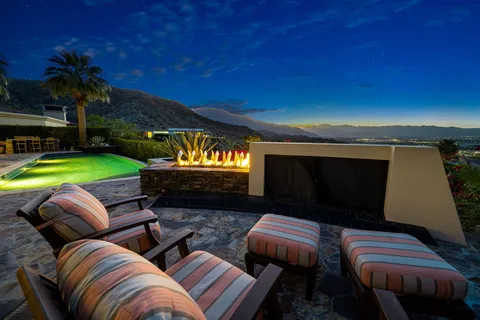 a view of a patio with swimming pool table and chairs