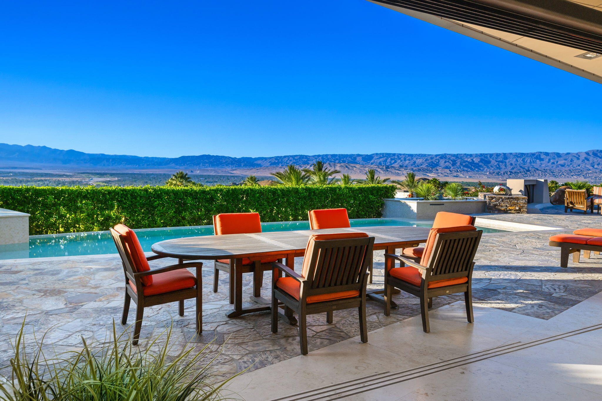 55 Granite Ridge Road Rancho Mirage, CA 92270 - Photo 25 of 34 a roof deck with table and chairs