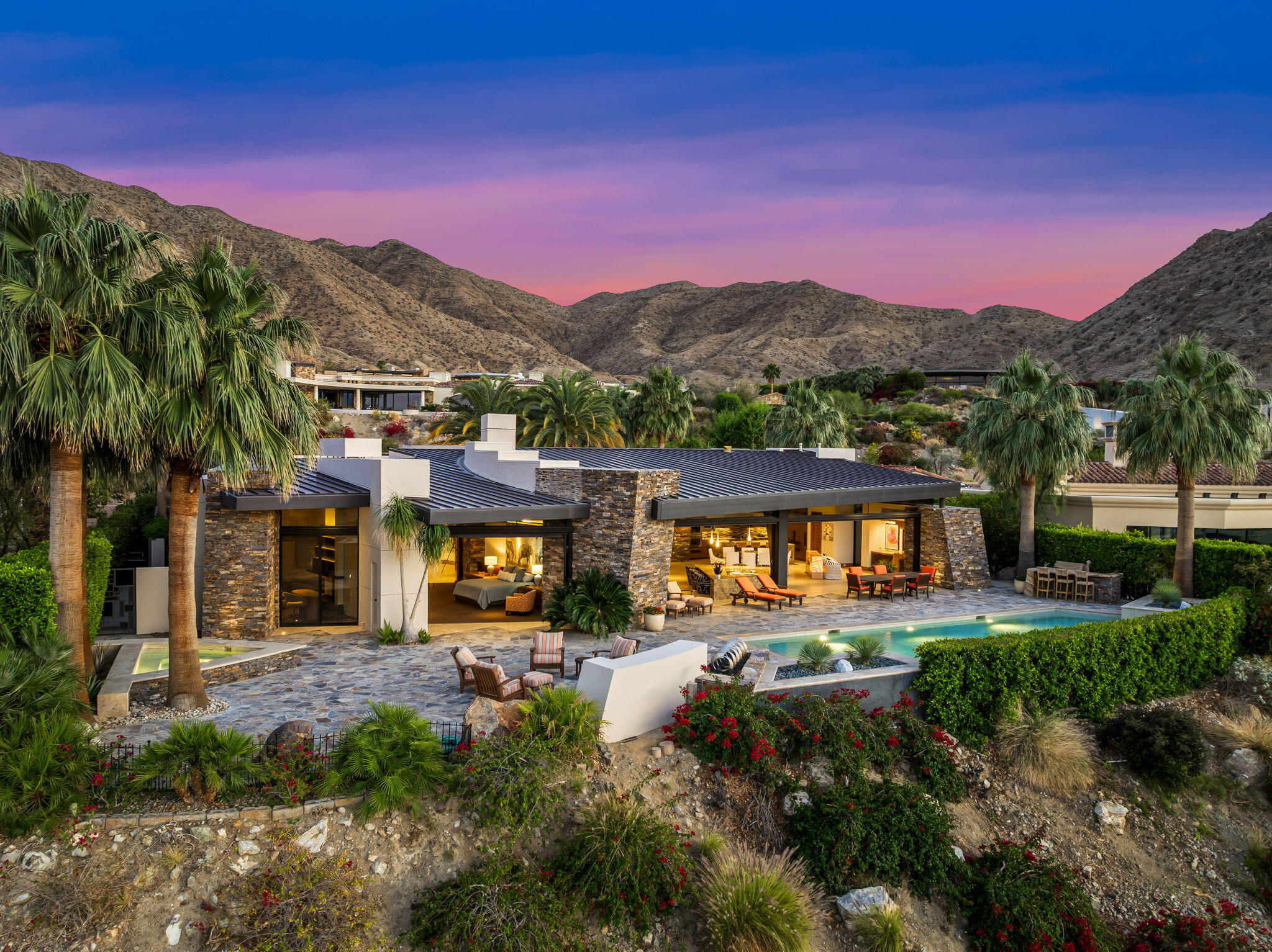 55 Granite Ridge Road Rancho Mirage, CA 92270 - Photo 30 of 34 a view of a town with swimming pool and mountain view