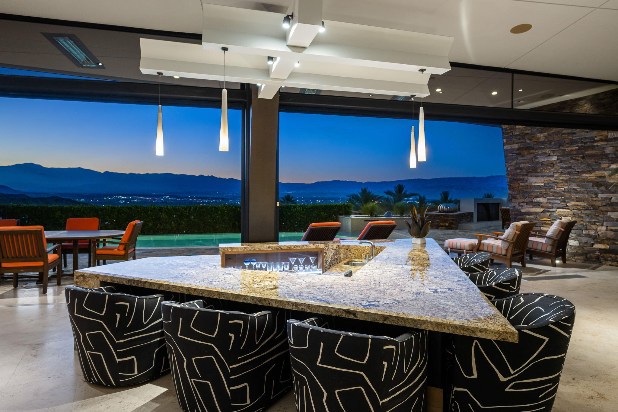 55 Granite Ridge Road Rancho Mirage, CA 92270 - Photo 34 of 34 a kitchen with a table chairs and a stove
