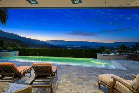 a view of a chairs and table in the patio