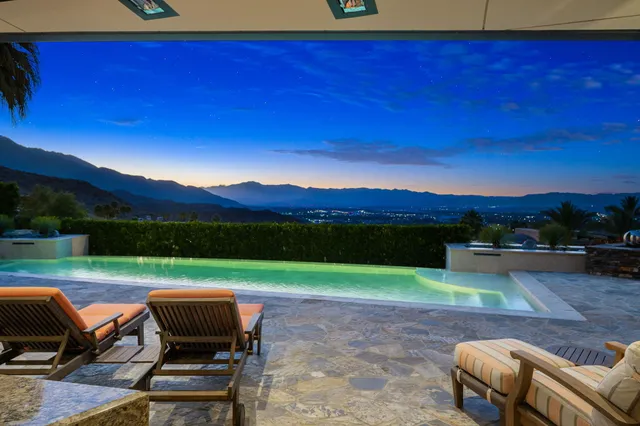 a view of a chairs and table in the patio