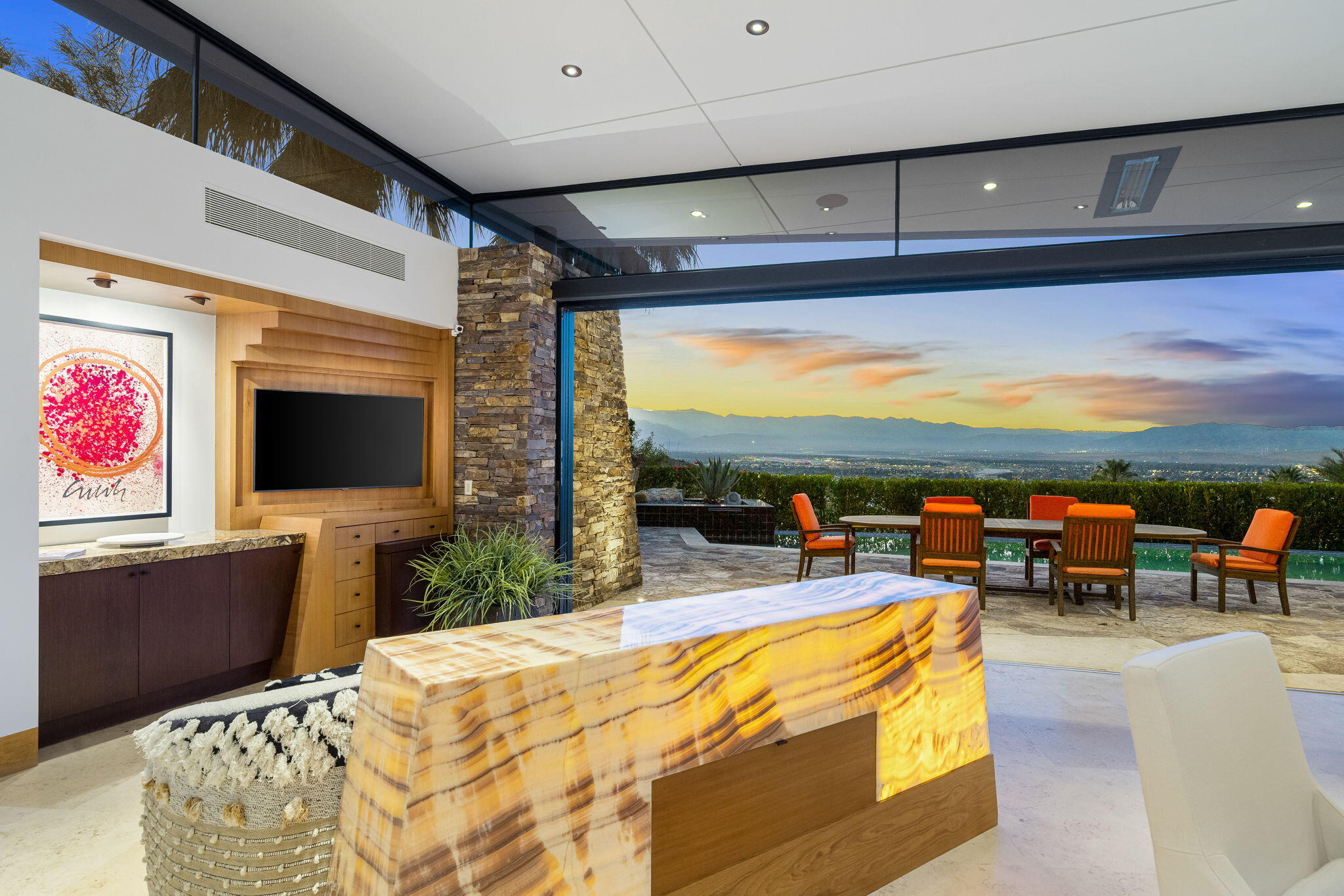 55 Granite Ridge Road Rancho Mirage, CA 92270 - Photo 7 of 34 a living room with patio furniture and a flat screen tv