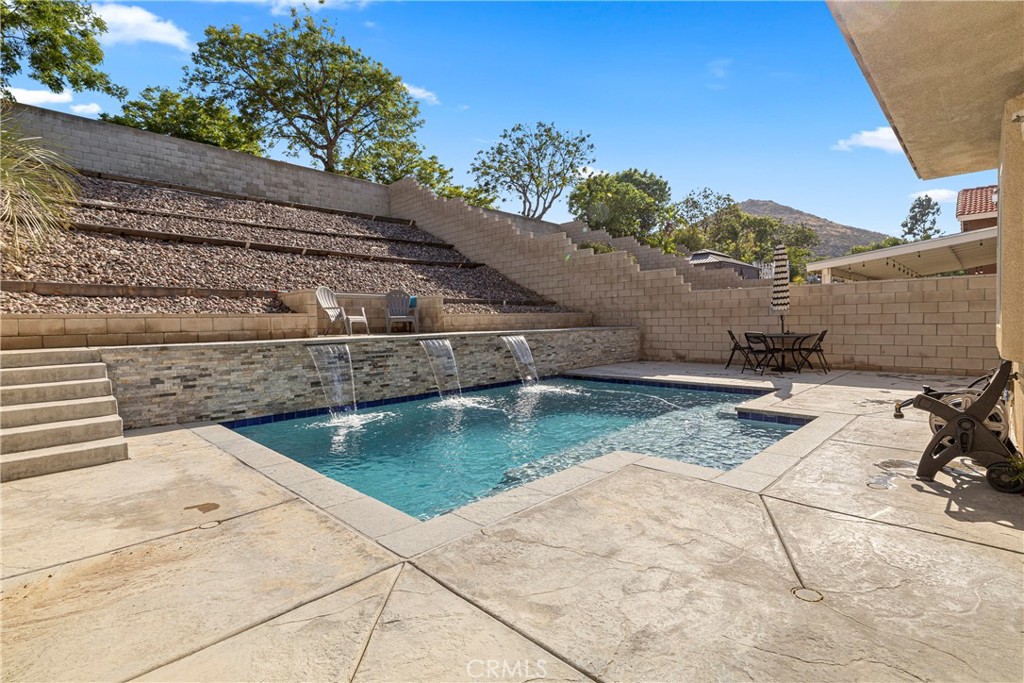 15417 Tobarra Road Fontana, CA 92337 - Photo 2 of 29 a view of a terrace with wooden fence