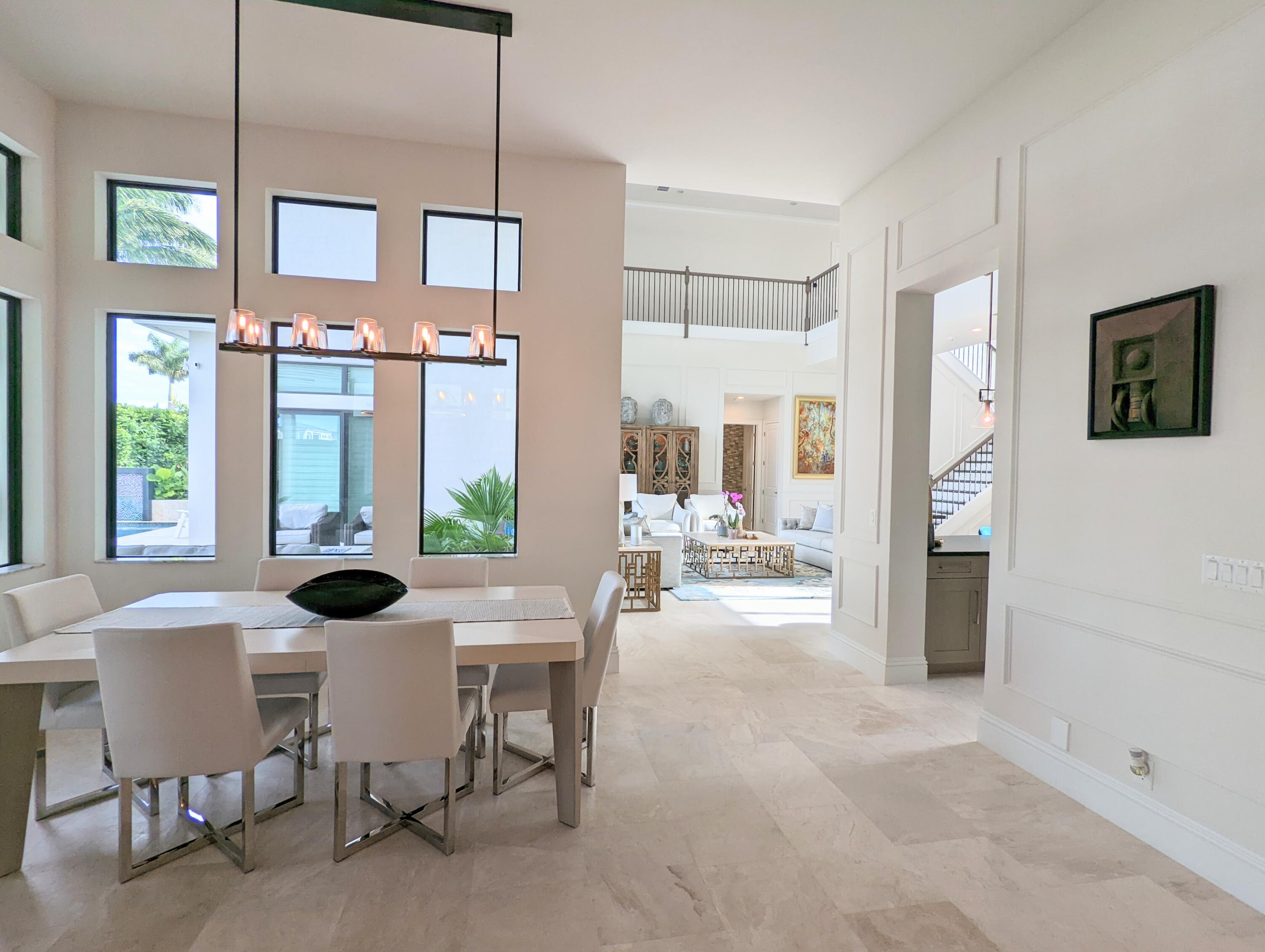 7095 Northwest 27th Avenue Boca Raton, FL 33496 - Photo 12 of 51 a view of a dining room with furniture window and outside view