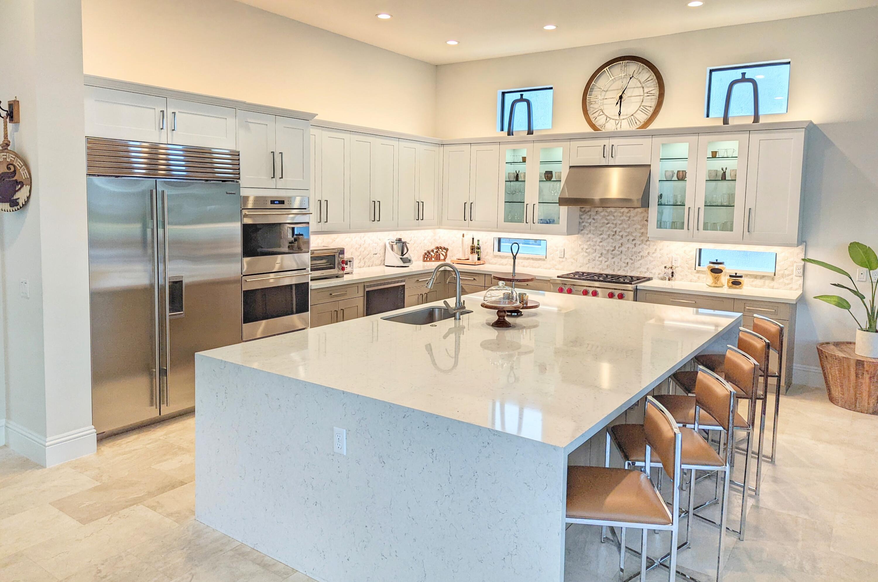 7095 Northwest 27th Avenue Boca Raton, FL 33496 - Photo 13 of 51 a kitchen with stainless steel appliances kitchen island granite countertop a sink a stove and refrigerator