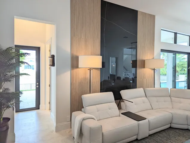 a bedroom with a bed couch and window