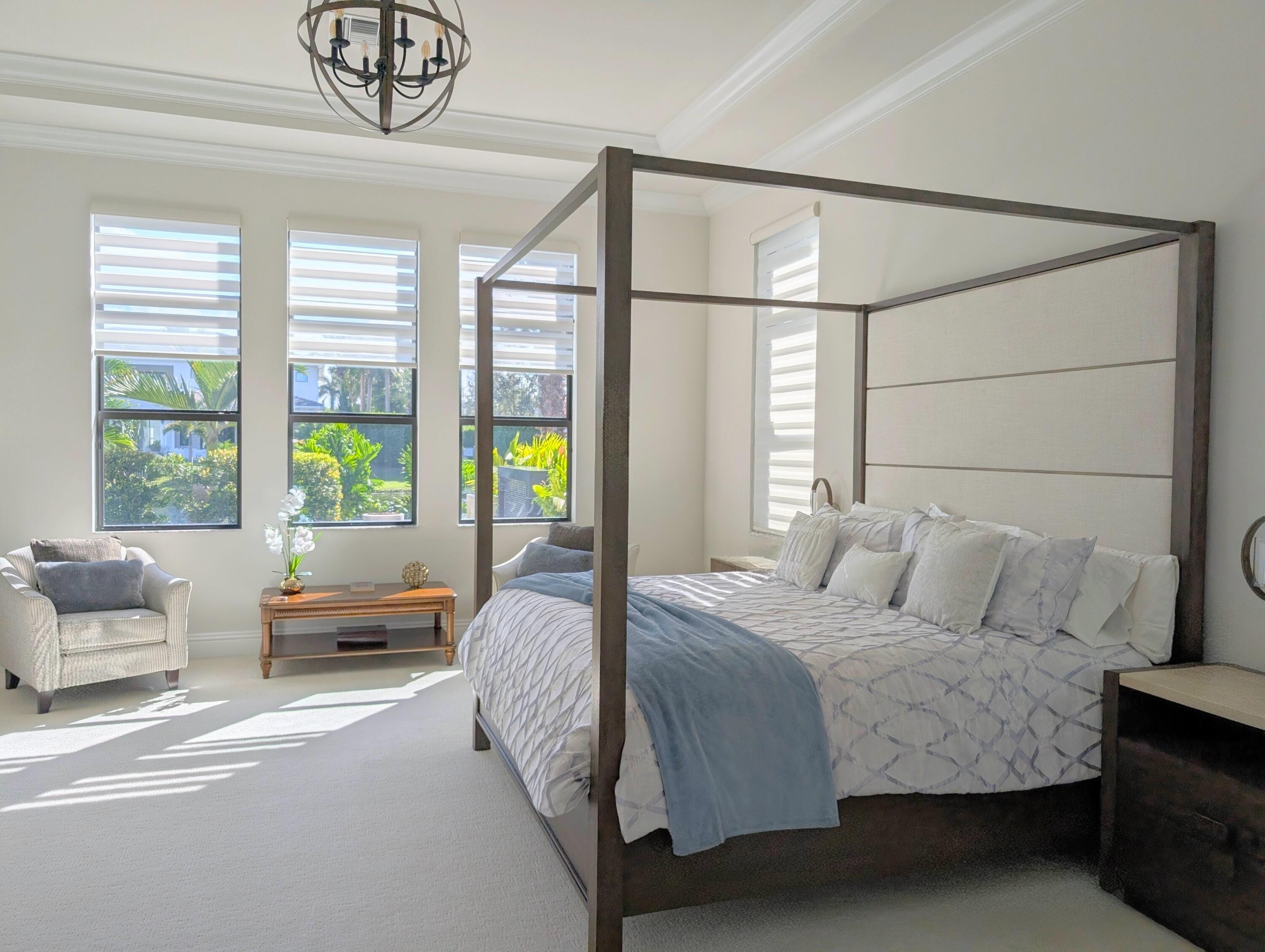 7095 Northwest 27th Avenue Boca Raton, FL 33496 - Photo 18 of 51 a bedroom with a bed couch and window