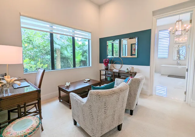 a spacious bathroom with sink and mirror