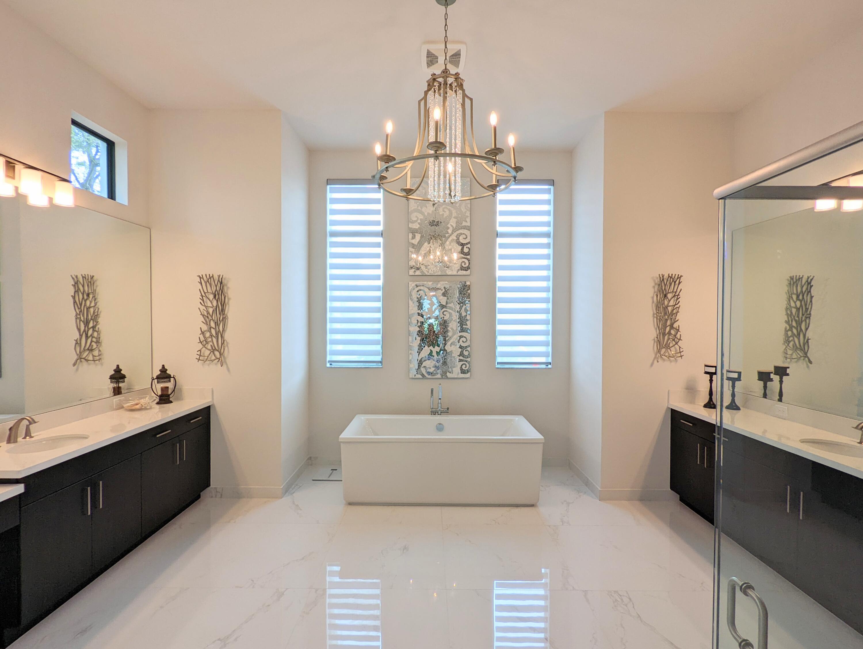 7095 Northwest 27th Avenue Boca Raton, FL 33496 - Photo 21 of 51 a spacious bathroom with sink and mirror