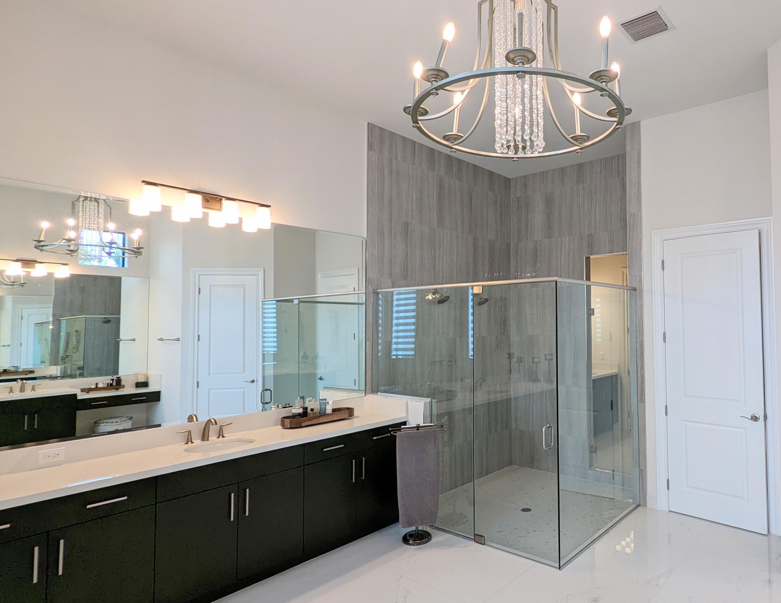 7095 Northwest 27th Avenue Boca Raton, FL 33496 - Photo 22 of 51 a bathroom with a sink a shower and a mirror