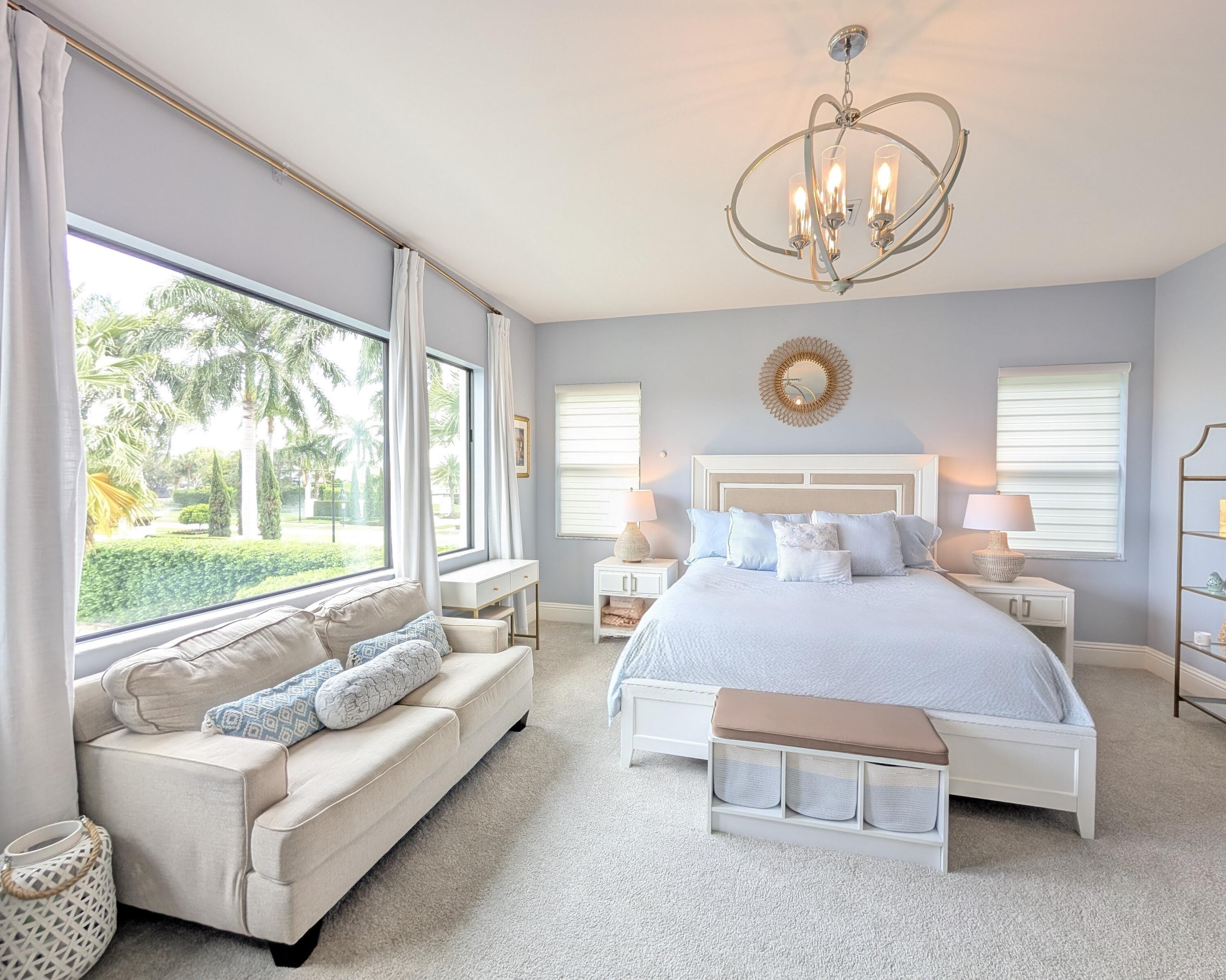 7095 Northwest 27th Avenue Boca Raton, FL 33496 - Photo 23 of 51 a bedroom with bed and a large window