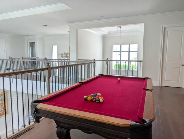 a room with gym equipment and view of living room
