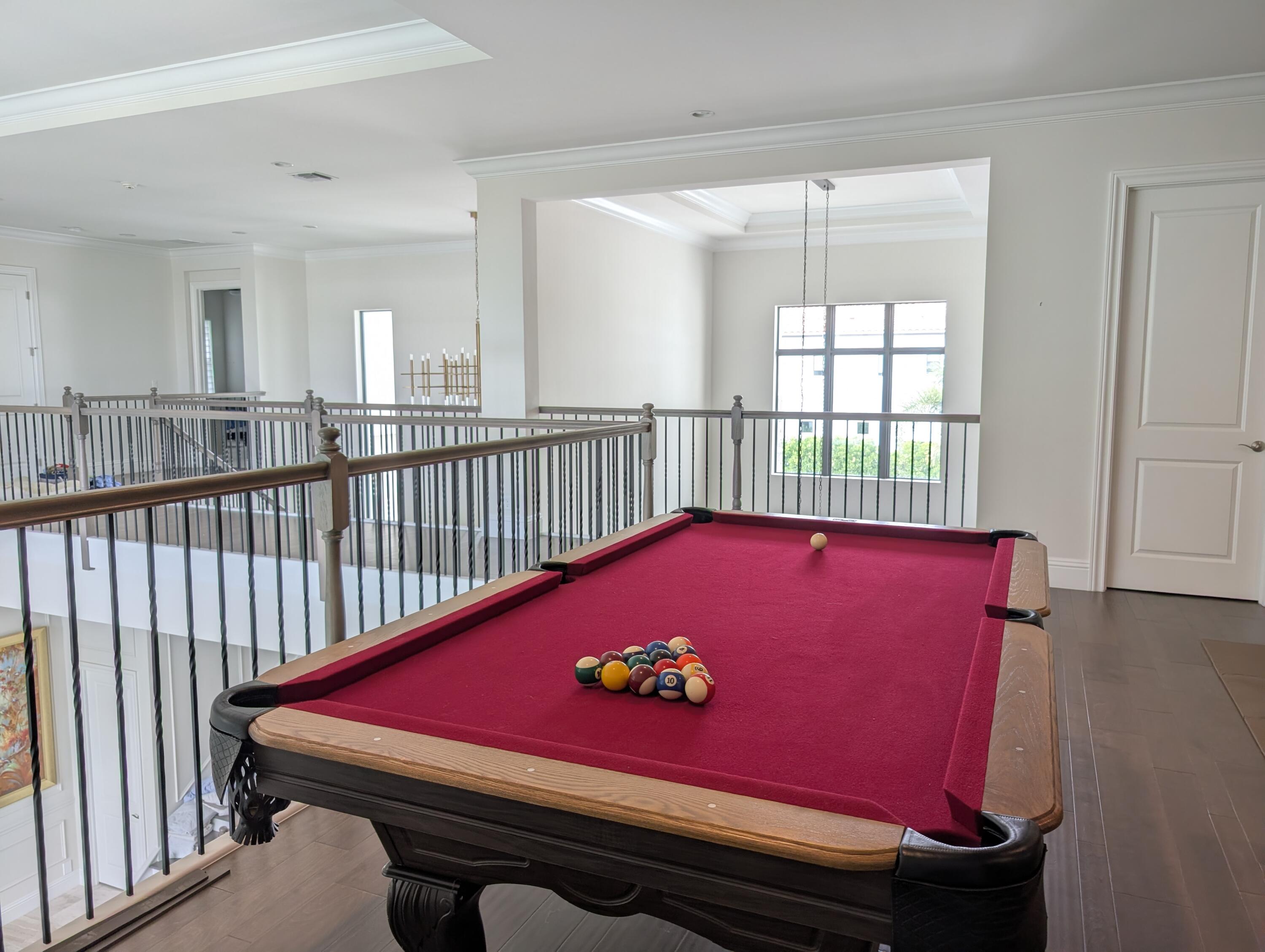 7095 Northwest 27th Avenue Boca Raton, FL 33496 - Photo 30 of 51 a view of a room with pool table and windows