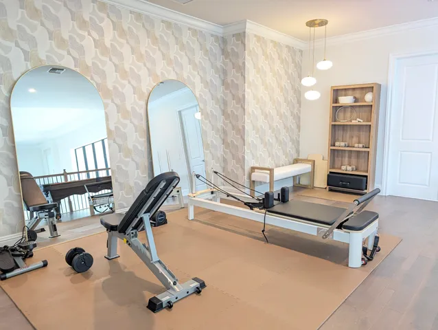 a living room with furniture a air conditioner and a window