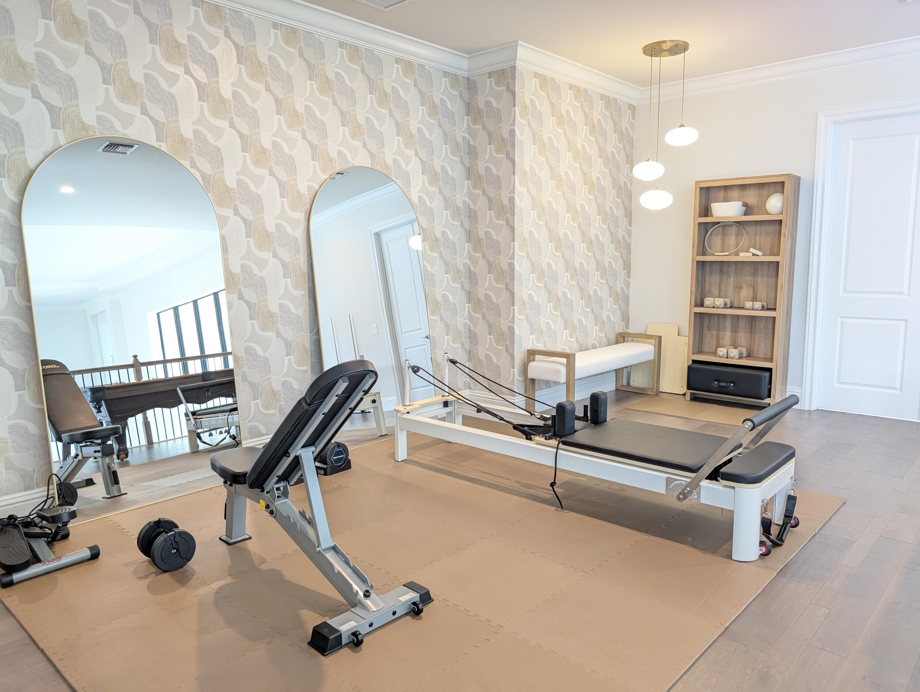 7095 Northwest 27th Avenue Boca Raton, FL 33496 - Photo 31 of 51 a room with gym equipment and view of living room