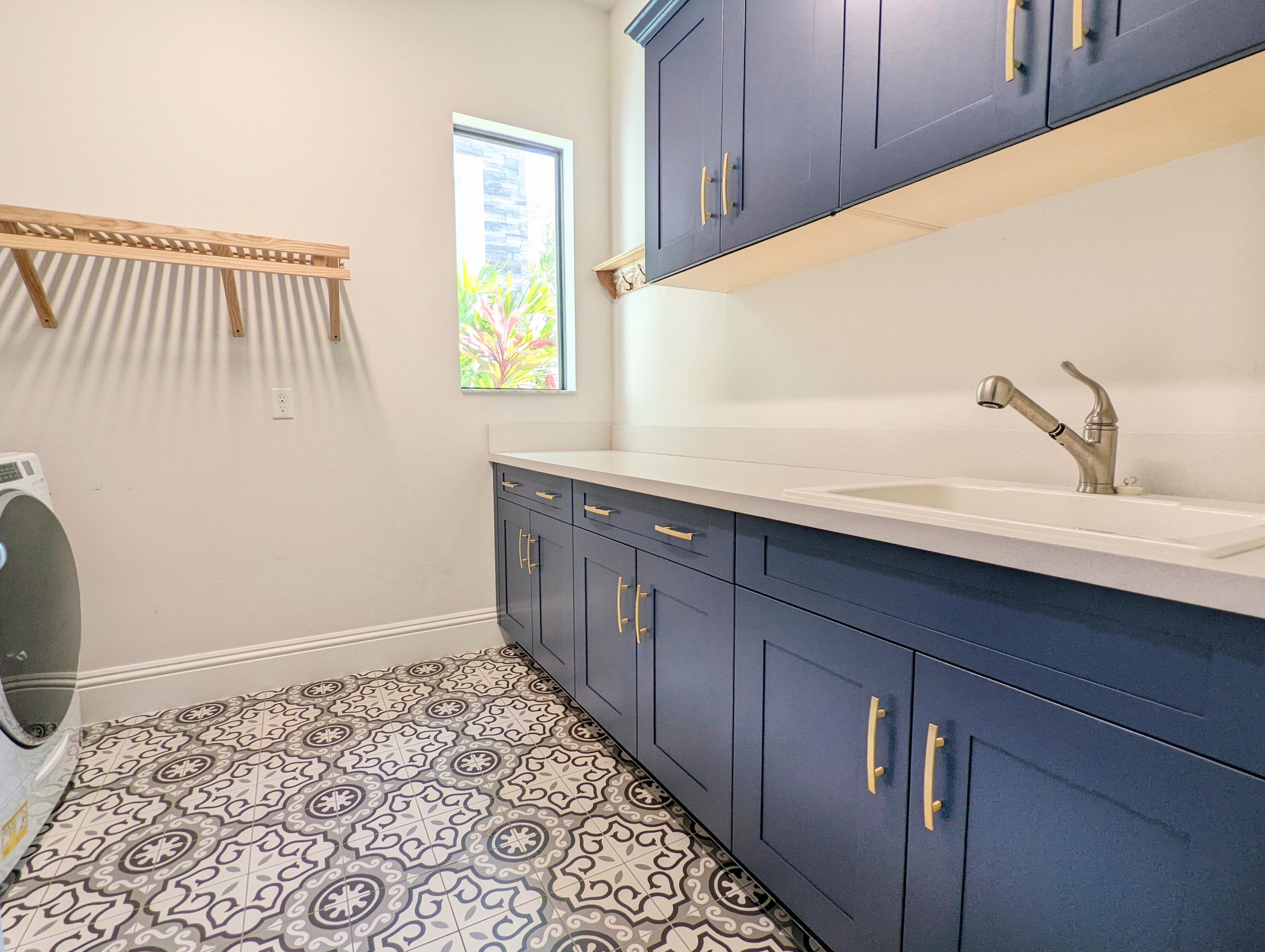 7095 Northwest 27th Avenue Boca Raton, FL 33496 - Photo 33 of 51 a bathroom with a sink and a mirror