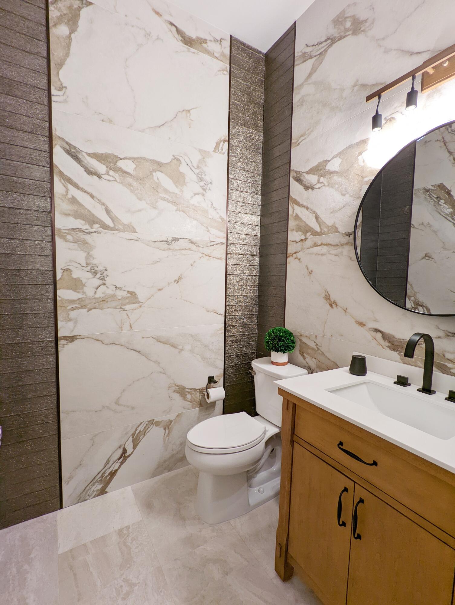 7095 Northwest 27th Avenue Boca Raton, FL 33496 - Photo 35 of 51 a bathroom with a sink and a mirror