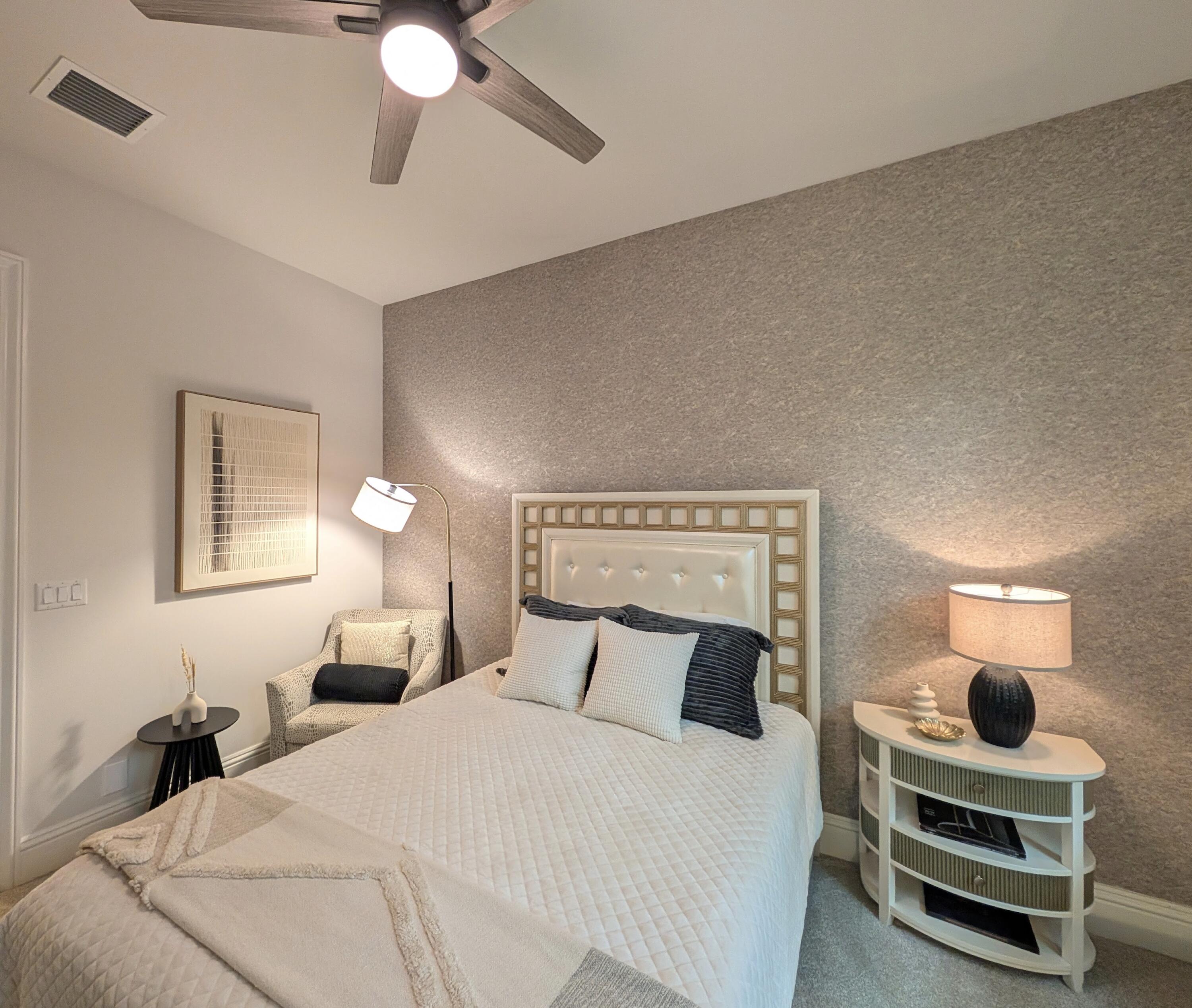 7095 Northwest 27th Avenue Boca Raton, FL 33496 - Photo 36 of 51 a bedroom with a bed and a chandelier