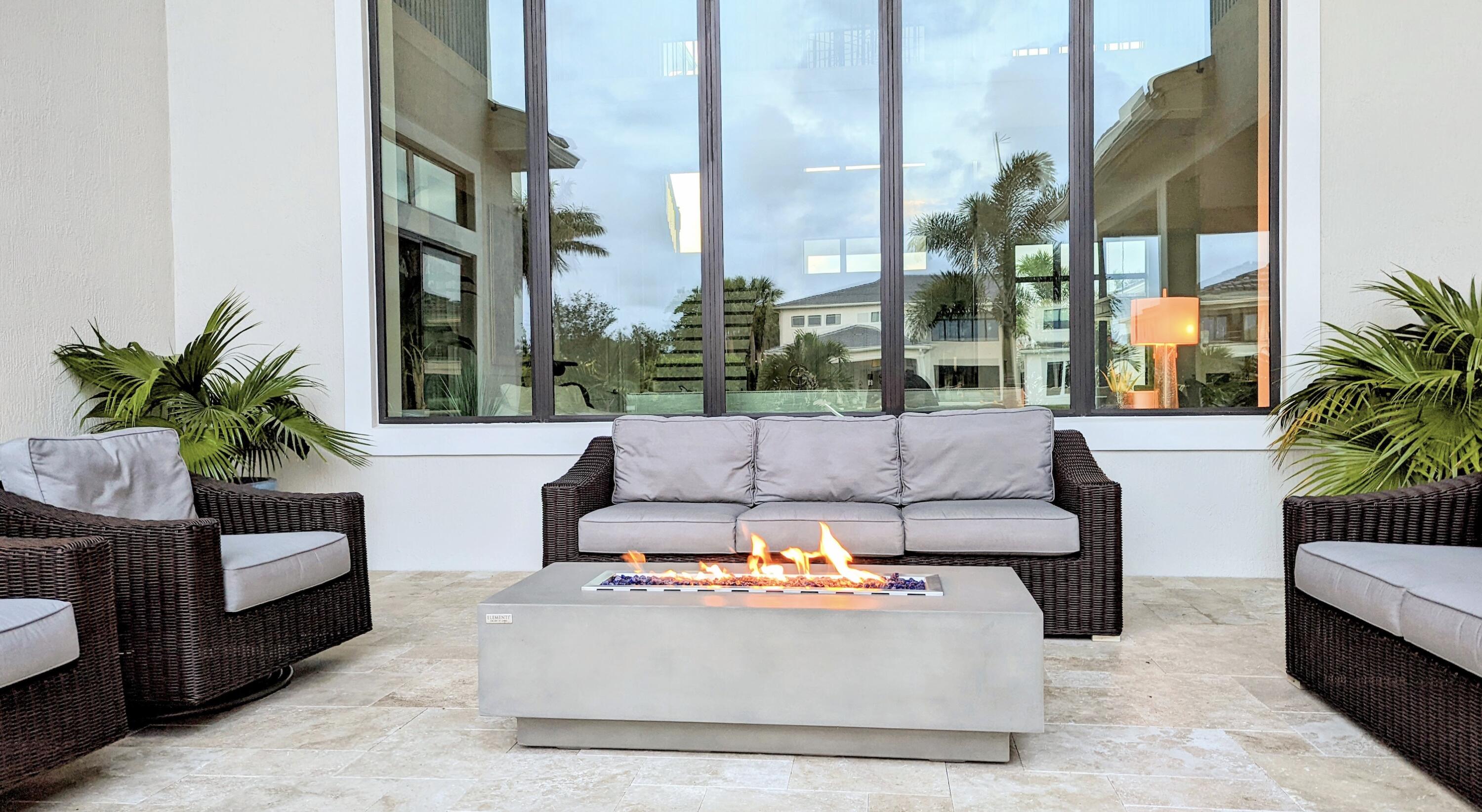 7095 Northwest 27th Avenue Boca Raton, FL 33496 - Photo 40 of 51 a living room with furniture flowerpot and a fountain