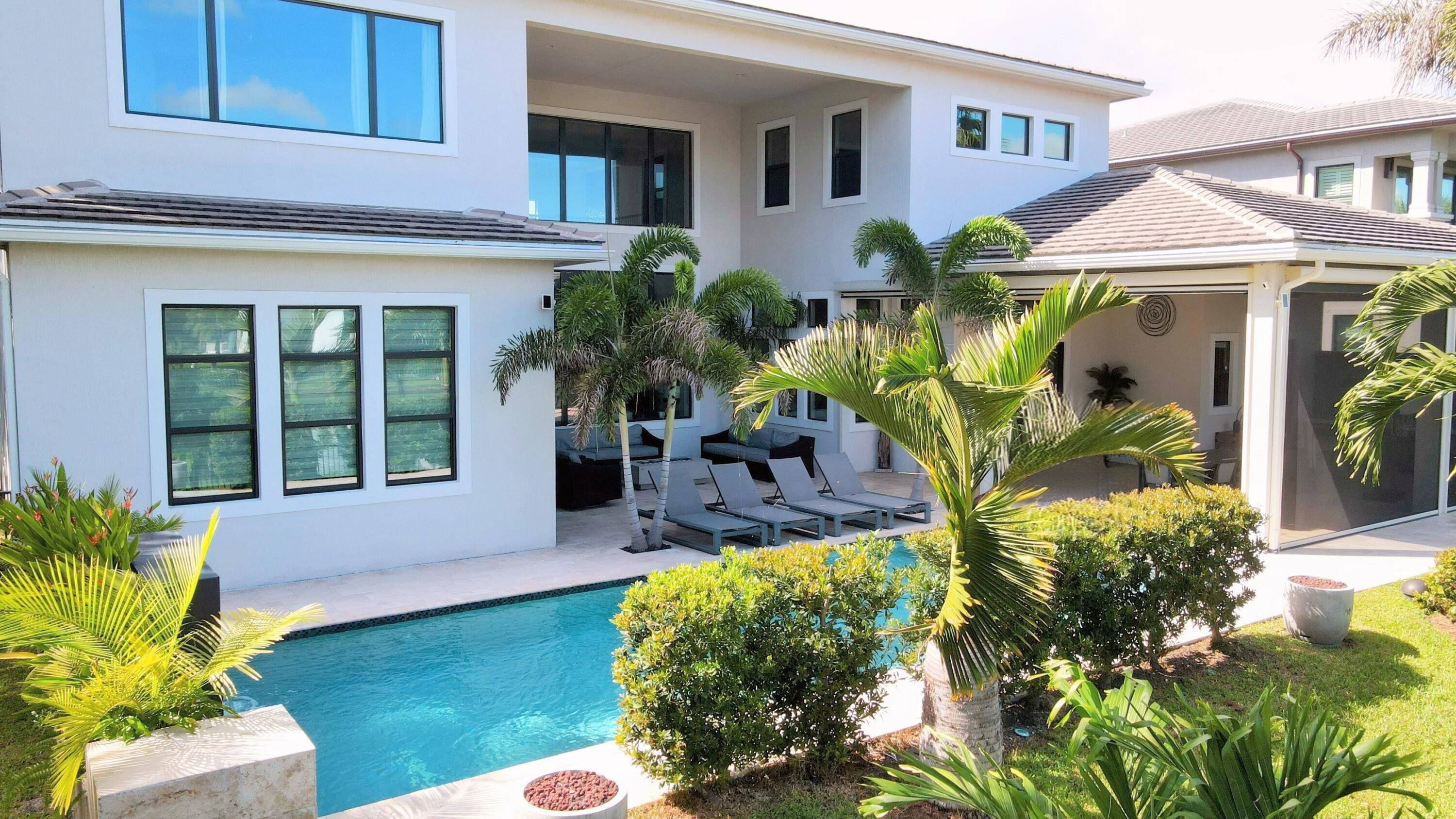 7095 Northwest 27th Avenue Boca Raton, FL 33496 - Photo 41 of 51 a front view of a house with patio