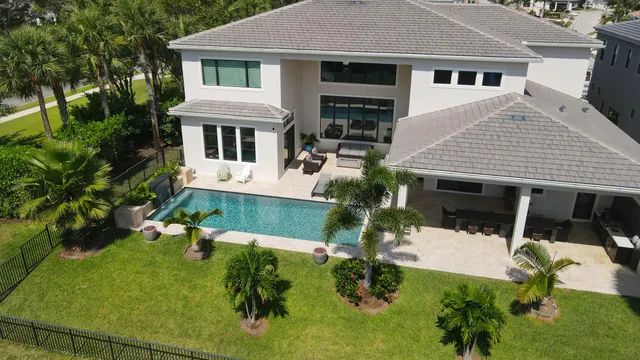 a view of swimming pool with a patio and a yard