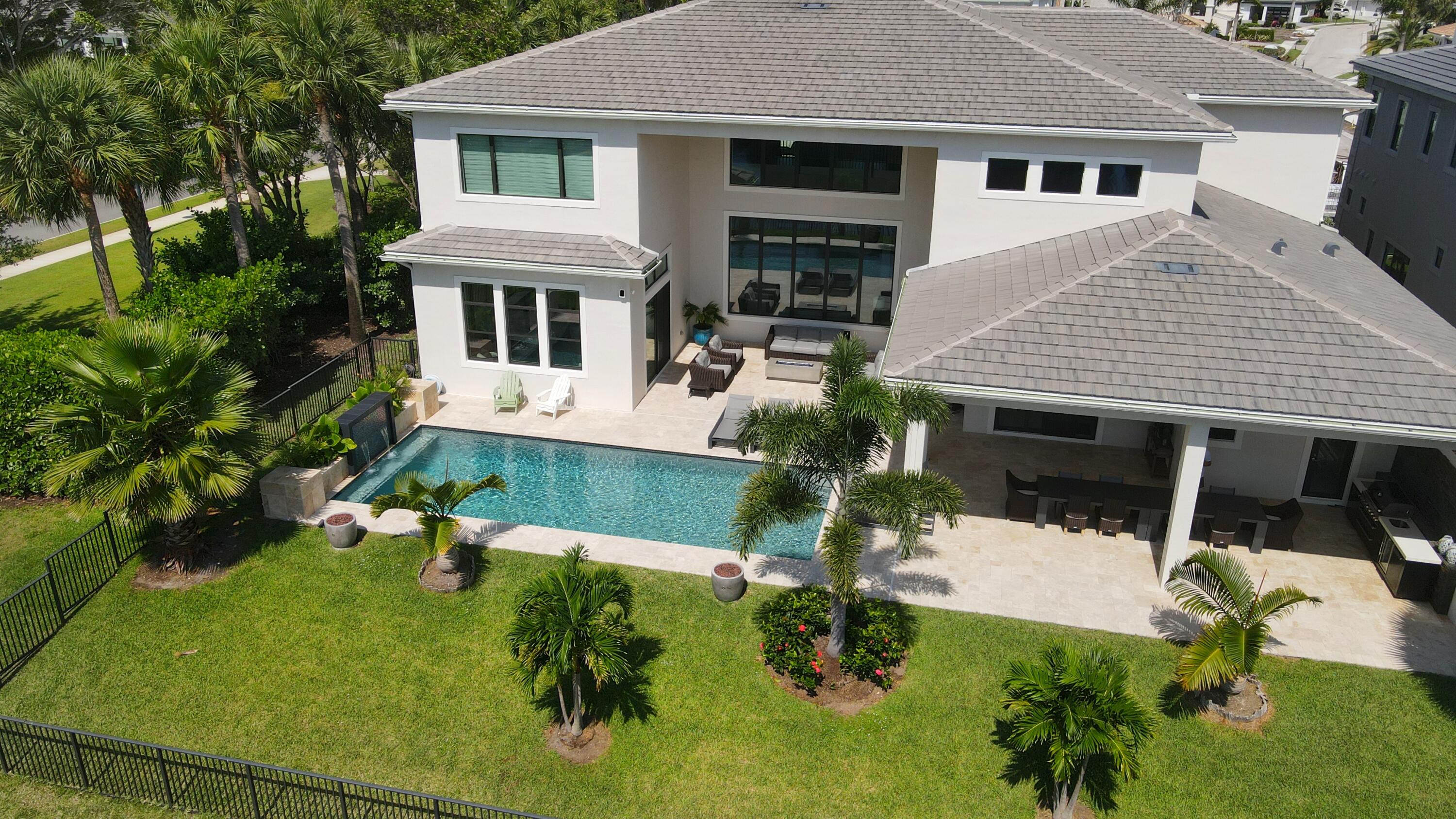 7095 Northwest 27th Avenue Boca Raton, FL 33496 - Photo 45 of 51 a view of house with a yard