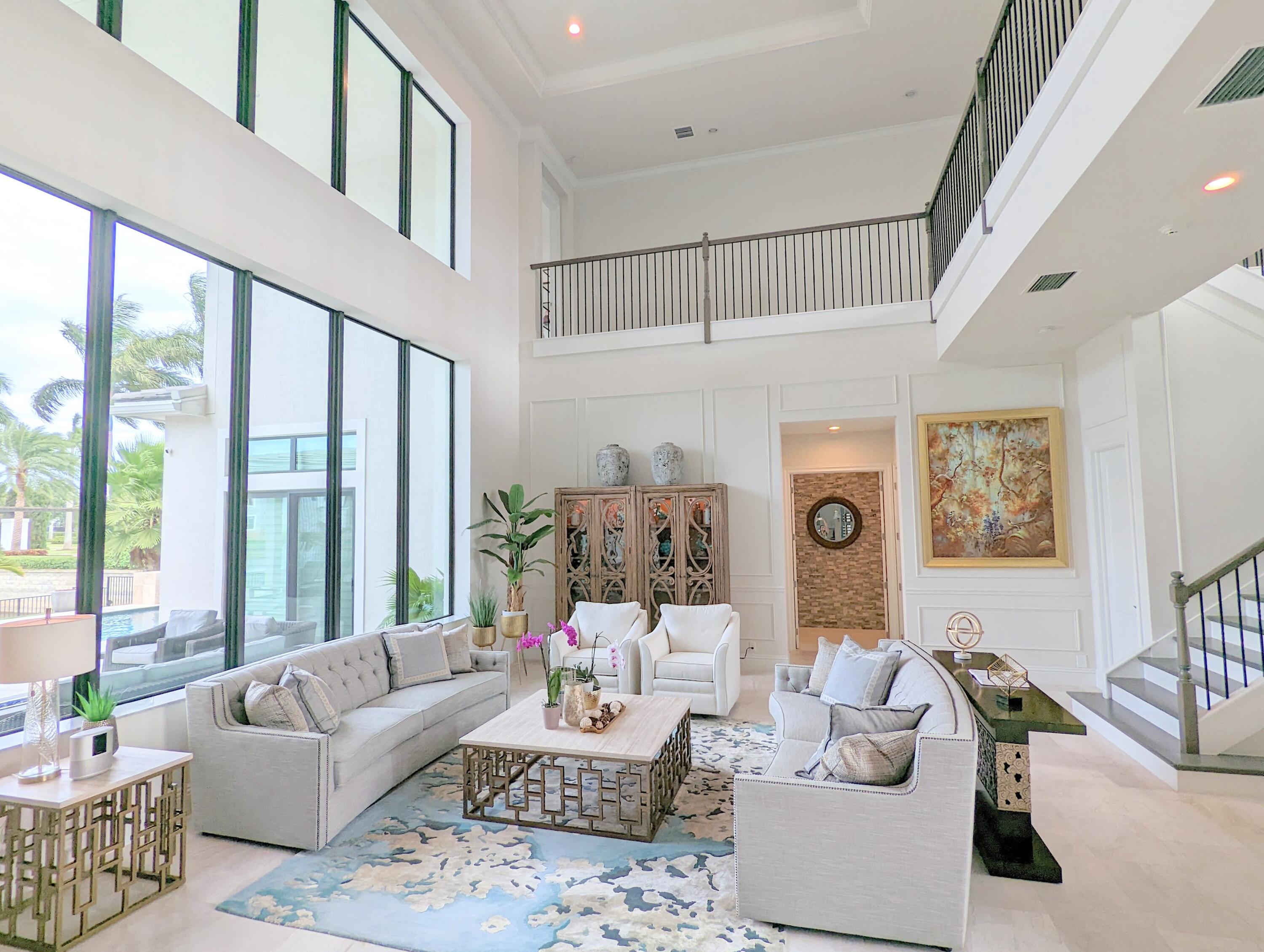 7095 Northwest 27th Avenue Boca Raton, FL 33496 - Photo 5 of 51 a living room with furniture and a large window