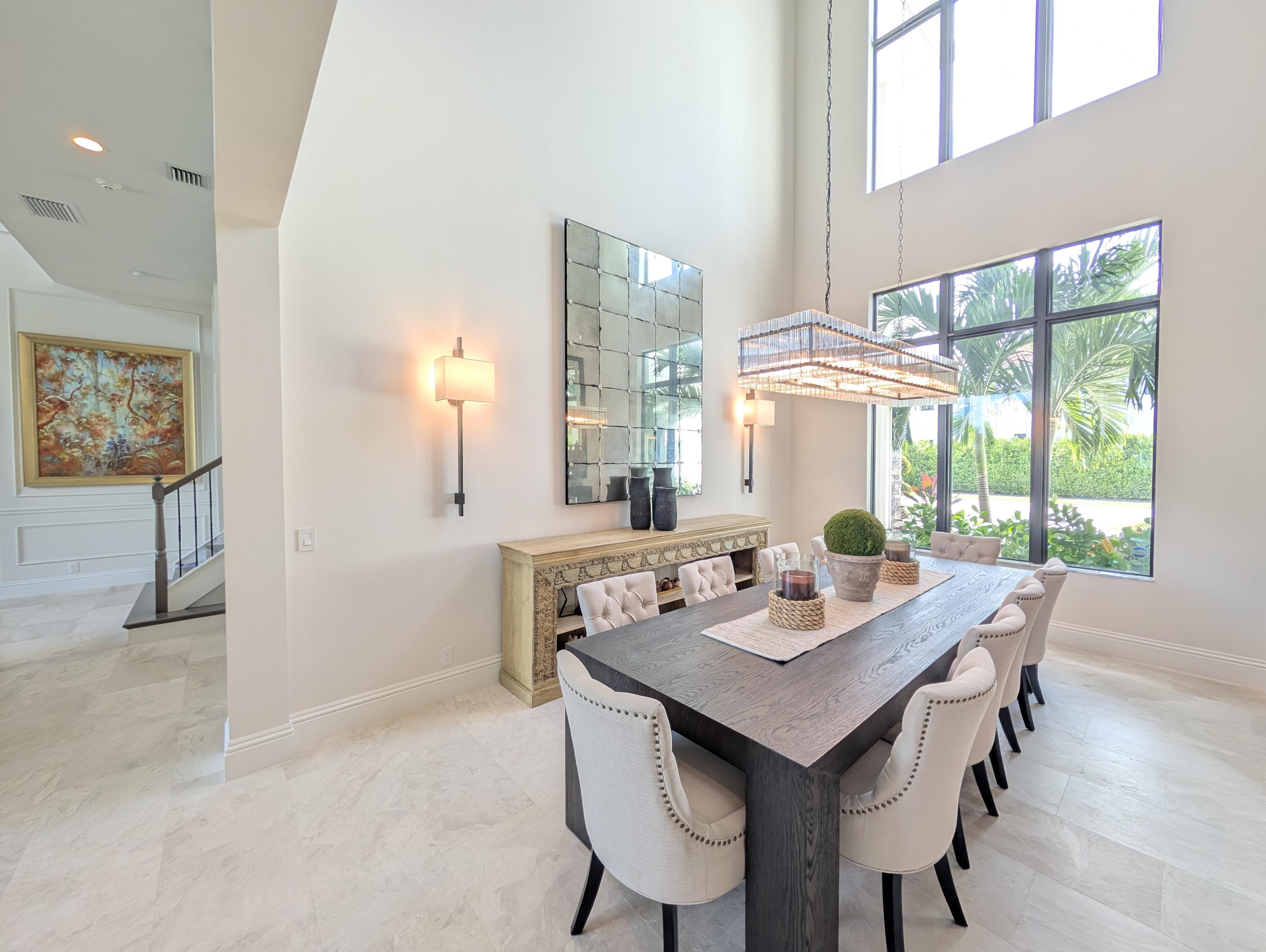 7095 Northwest 27th Avenue Boca Raton, FL 33496 - Photo 8 of 51 a view of a dining room with a table and chairs