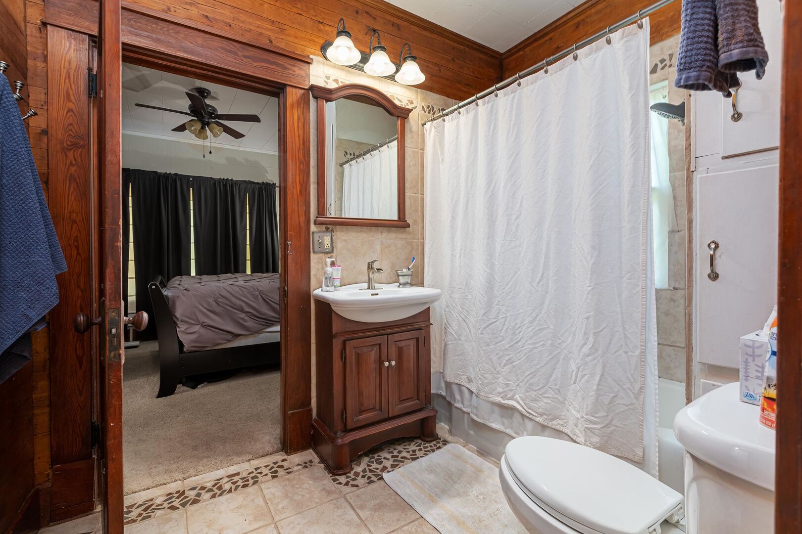 505 California Street Carterville, IL 62918 - Photo 17 of 23 a bathroom with a sink a toilet and shower