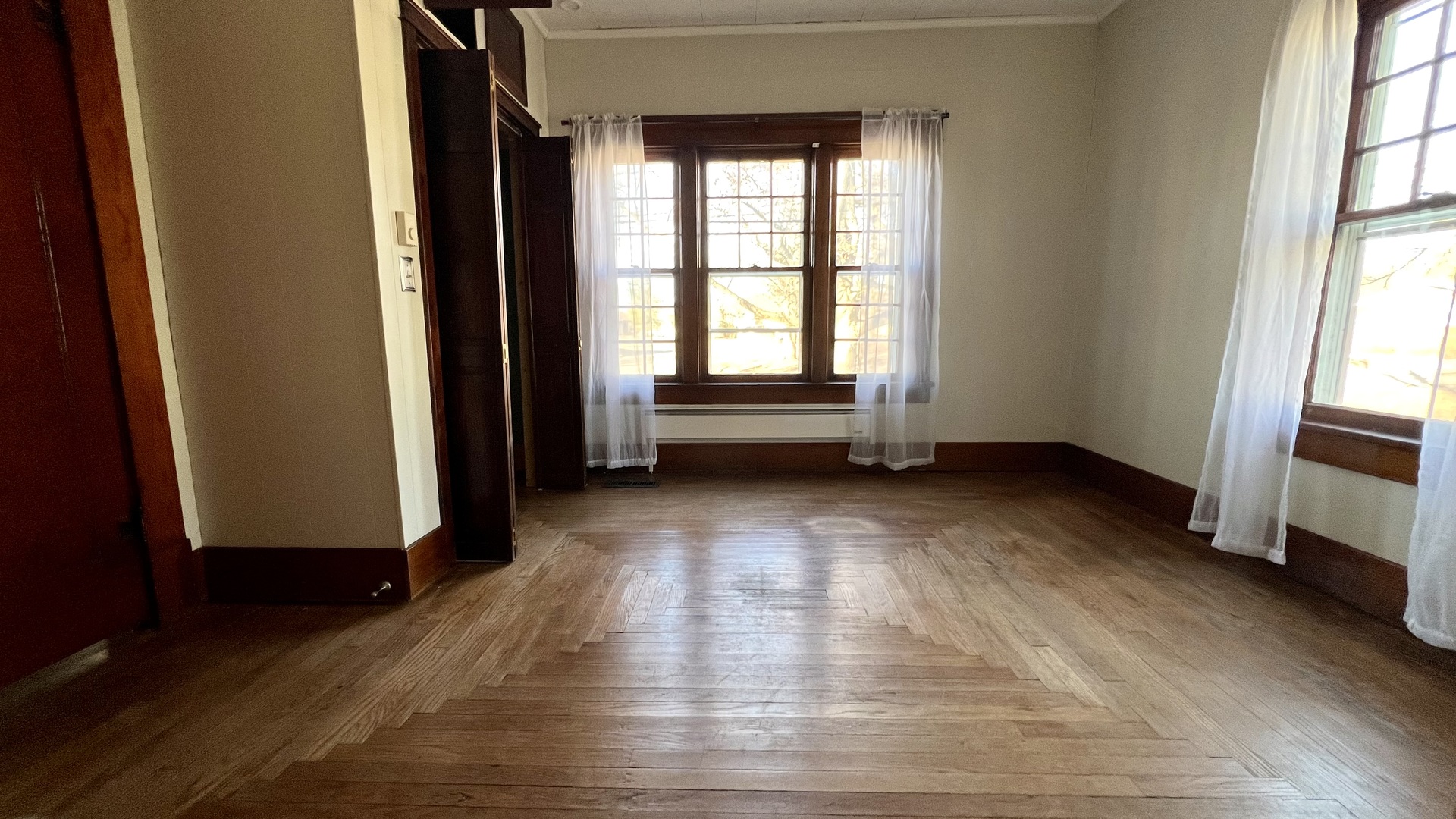 505 California Street Carterville, IL 62918 - Photo 19 of 23 a view of empty room with wooden floor and fan