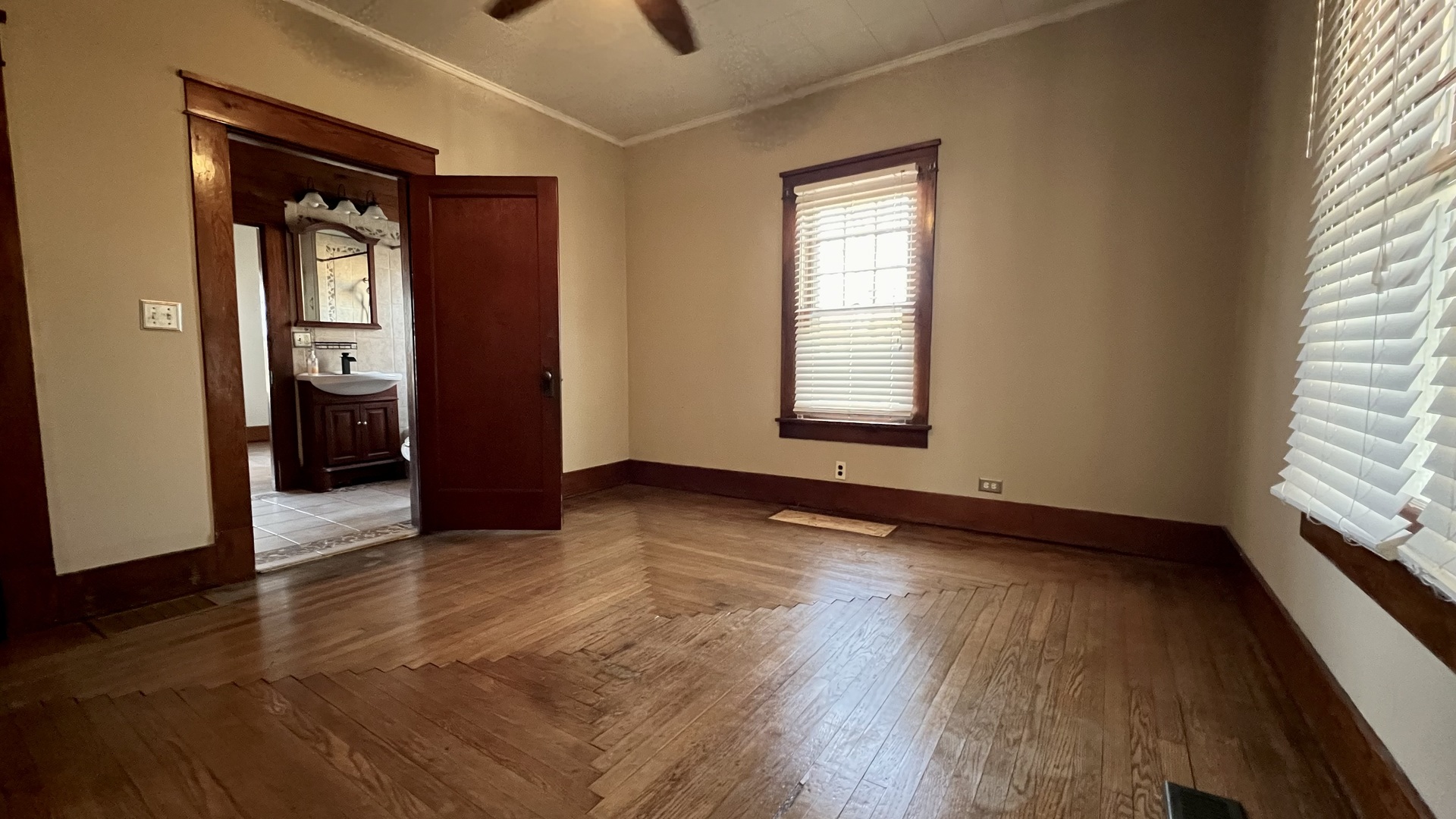 505 California Street Carterville, IL 62918 - Photo 20 of 23 an empty room with wooden floor and windows