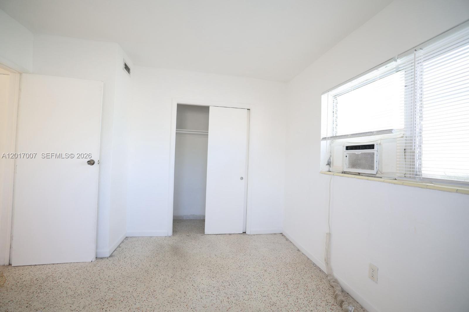 800 83rd Street, Unit 2 Miami Beach, FL 33141 - Photo 7 of 10 a view of an empty room with a window