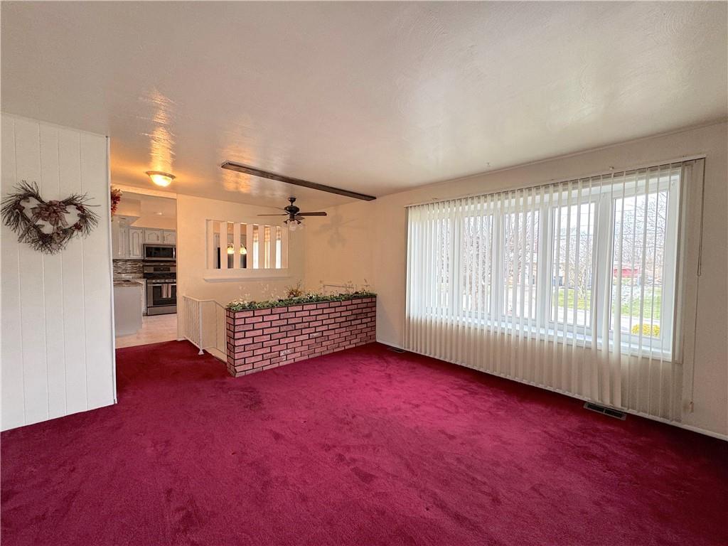 111 Mt Pleasant Boulevard Irwin, PA 15642 - Photo 14 of 27 wooden floor in an empty room with a window