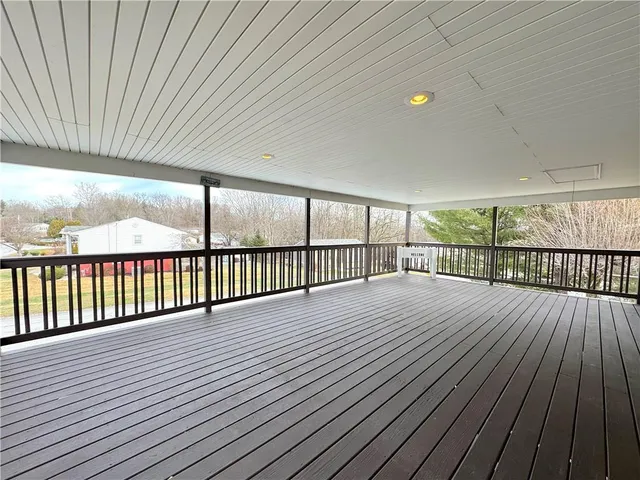 a view of balcony with wooden floor