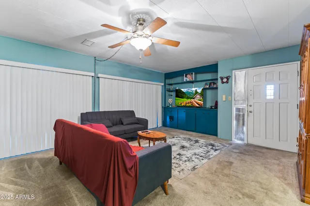 a bedroom with a bed and a chair