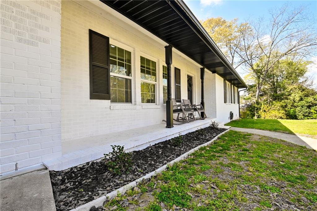 150 Sims Street Winder, GA 30680 - Photo 46 of 61 a front view of a house with garden