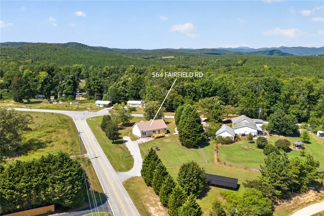 564 Fairfield Road Walhalla, SC 29691 - Photo 49 of 50 Lush green forests and rolling hills frame this peaceful countryside property.