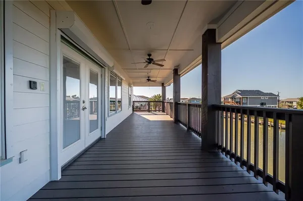 a view of a porch with wooden floor and outdoor space