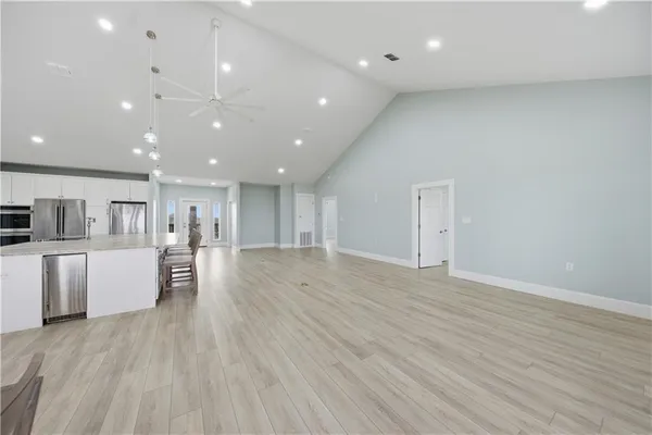 a room with furniture and kitchen view