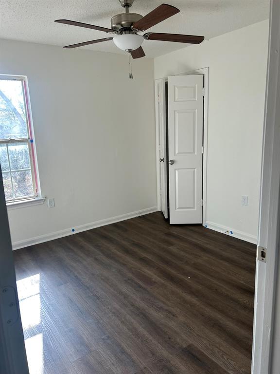 4720 Burma Road Dallas, TX 75216 - Photo 8 of 13 a view of empty room with wooden floor and fan
