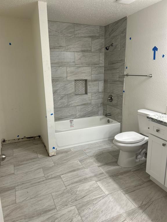 4720 Burma Road Dallas, TX 75216 - Photo 9 of 13 a bathroom with a toilet and a shower