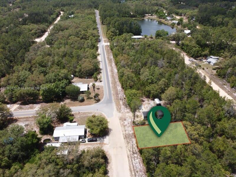 105 Wallace Street Interlachen, FL 32148 - Photo 2 of 7 an aerial view of a house with outdoor space