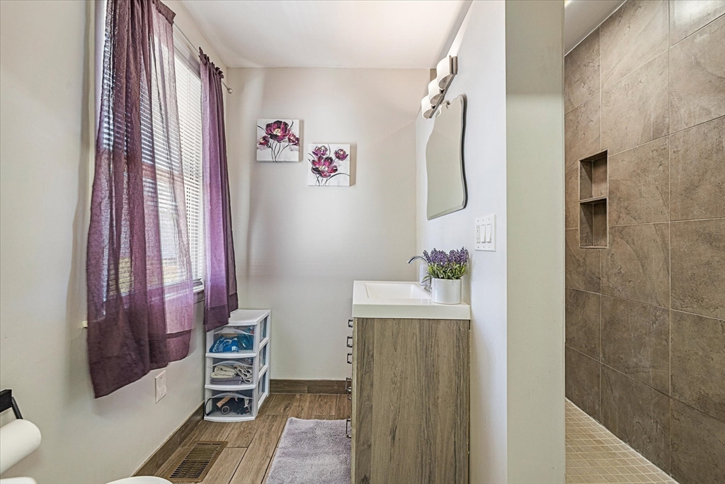 14 Grosvenor Street Ayer, MA 01432 - Photo 16 of 30 a bathroom with a bathtub a shower and a sink