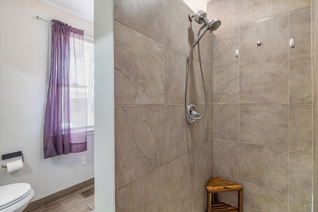 14 Grosvenor Street Ayer, MA 01432 - Photo 17 of 30 a bathroom with a shower and a toilet