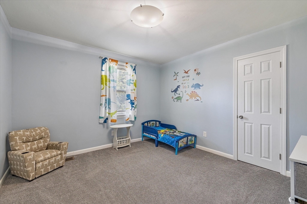 14 Grosvenor Street Ayer, MA 01432 - Photo 21 of 30 a living room with furniture and a window