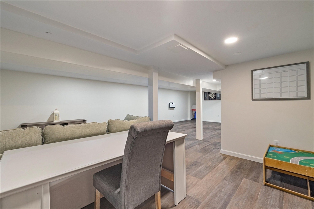 14 Grosvenor Street Ayer, MA 01432 - Photo 25 of 30 a living room with furniture and wooden floor