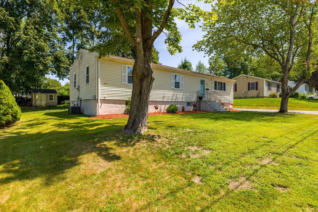 14 Grosvenor Street Ayer, MA 01432 - Photo 3 of 30 a view of a house with a backyard