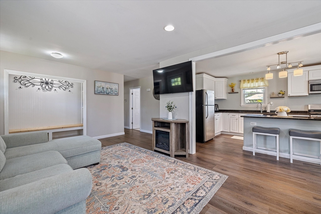 14 Grosvenor Street Ayer, MA 01432 - Photo 5 of 30 a living room with furniture and a flat screen tv