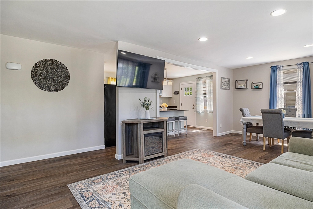 14 Grosvenor Street Ayer, MA 01432 - Photo 7 of 30 a living room with furniture and a fireplace